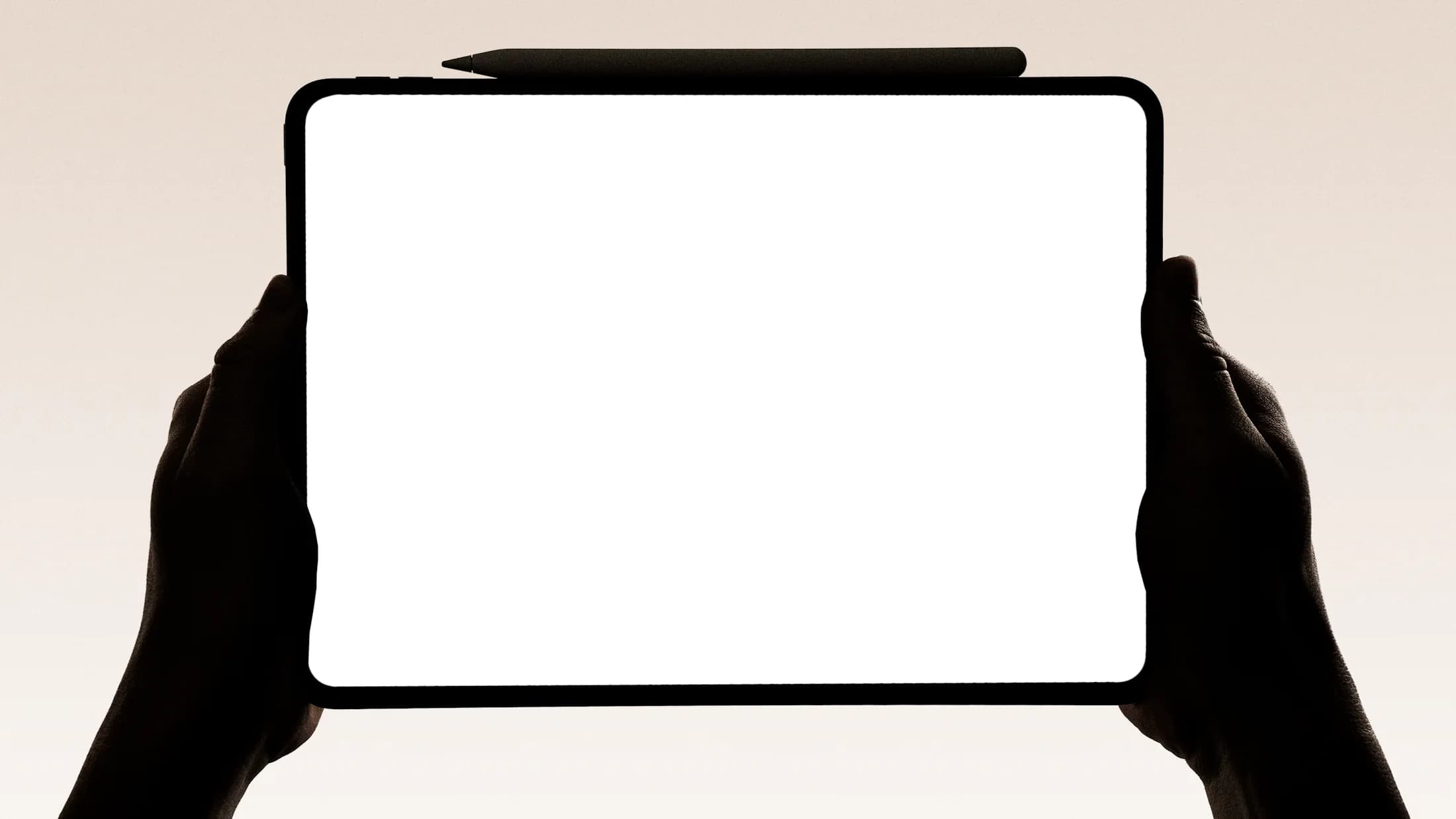Hands working on a tablet with a stylus