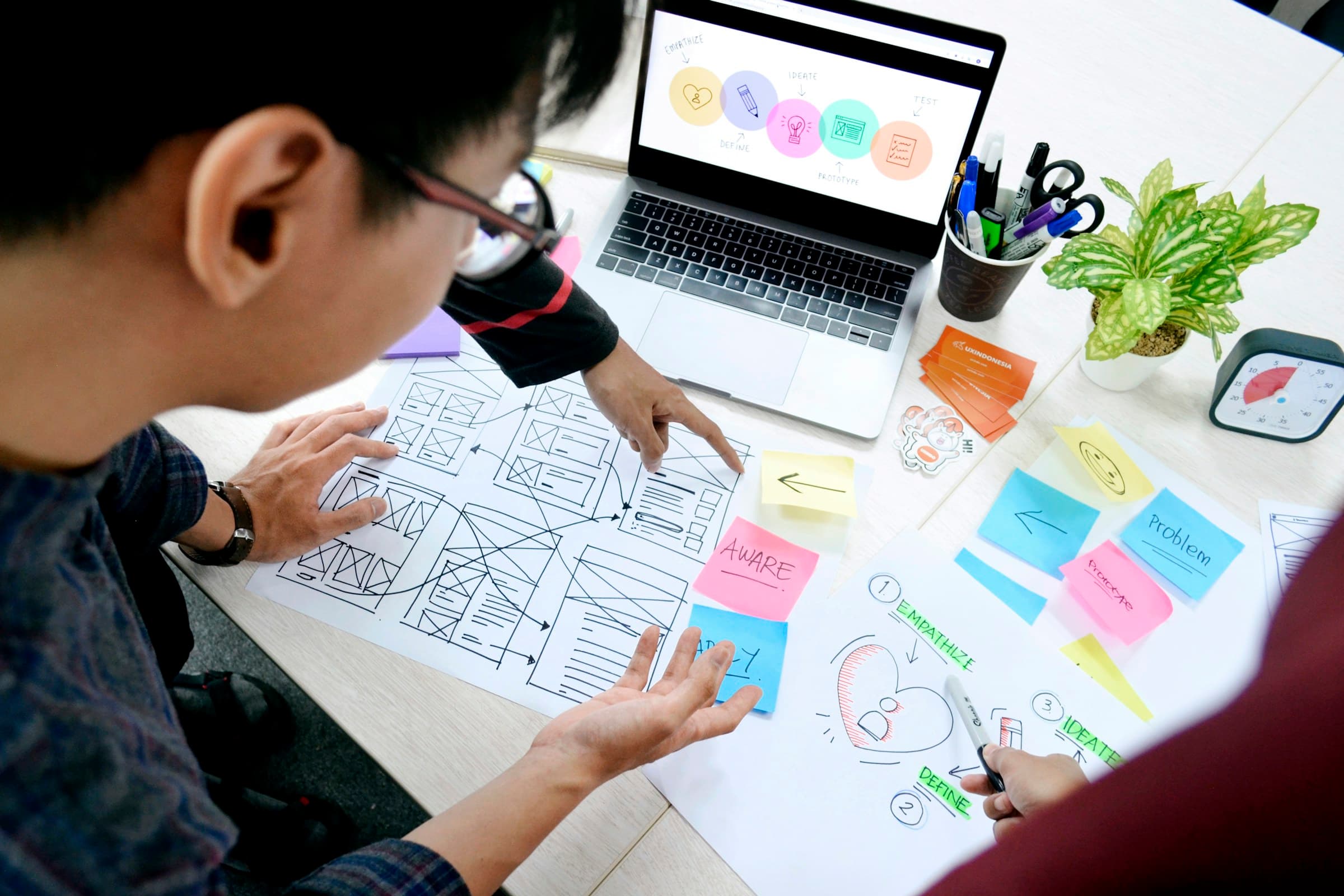 A designer working through interface wireframes